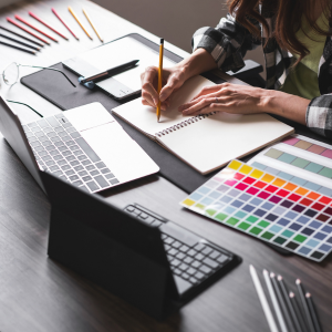 A designer working on monthly maintenance for a brand. BS Creative Co.’s monthly maintenance plans offering ongoing graphic design, web support and brand refresh services. Keep your visuals and website updated without the headache.