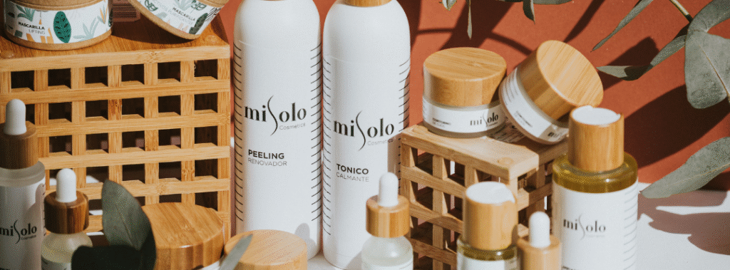 Cohesive skincare packaging with bamboo accents and consistent logo, illustrating strong brand identity for a small business.