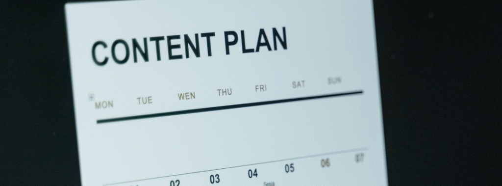 Calendar and creative tools on a designer's computer—representing year-round campaign planning with monthly design support.