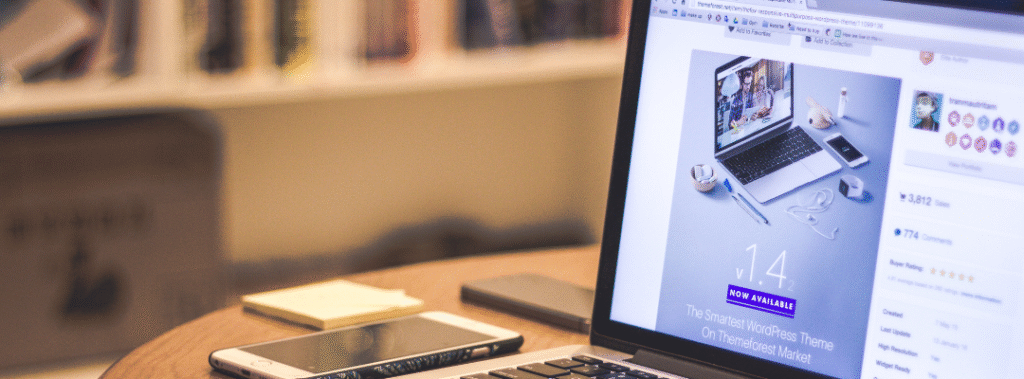 Laptop displaying a clean website template on a desk, an example of small business website design that looks professional.