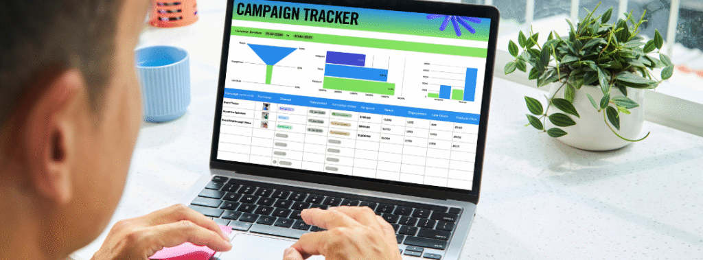 Person reviewing a campaign tracker dashboard on a laptop, applying a brand consistency checklist for Q4 campaigns.