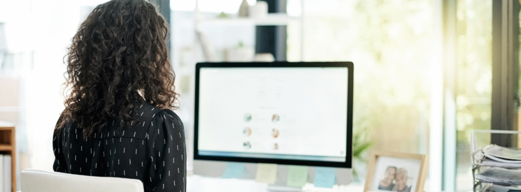 Two teammates comparing a brand style guide and a campaign plan, visual for branding vs marketing working together.