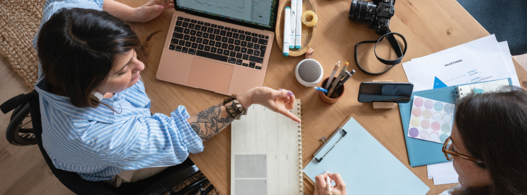 Two designers working on the brand discovery process, to ensure consistency across all deliverables.