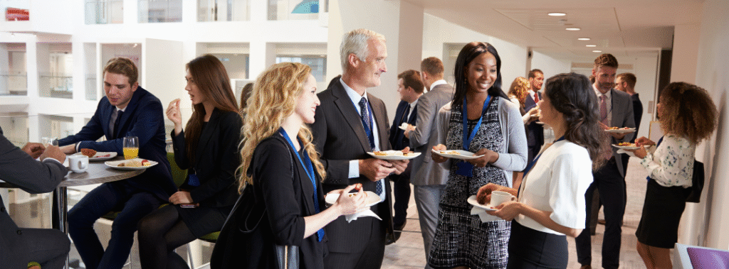 A group of people gather at a business event, illustrating the importance of Sacramento event marketing in 2026.