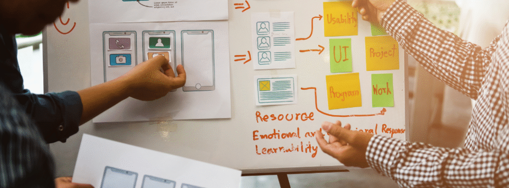 A group of designers work on creating a website, illustrating the importance of accessibility in web design.