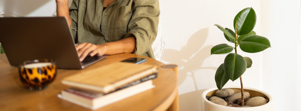 A business owner sits at her computer, working on building a stronger online presence in 2026.